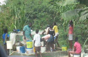 people fetching water